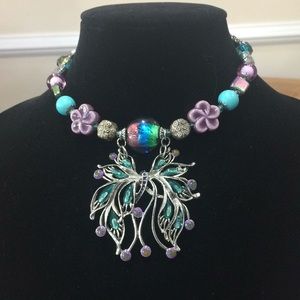 Choker style necklace with a butterfly style